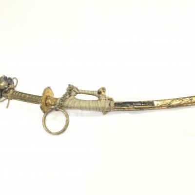 A miniature model of a Japanese wakizashi sword with scabbard, 23cm long. This lot cannot be posted