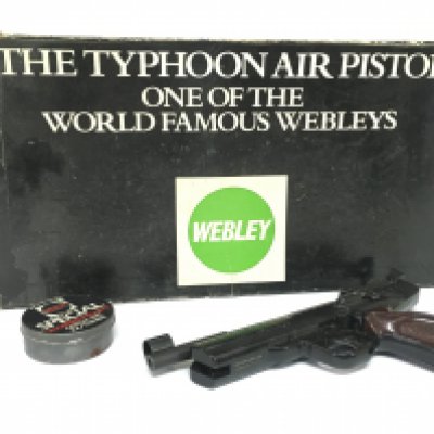 A boxed vintage Webley Typhoon air pistol, working mechanism. Some damage as seen.