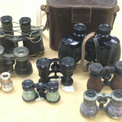 A collection of binoculars and opera glasses. Postage C