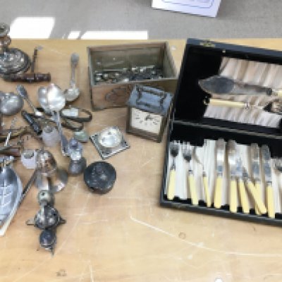A collection of silver plated cutlery and other oddments including corkscrews