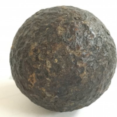 An iron cannonball, 8cm wide. Postage category B