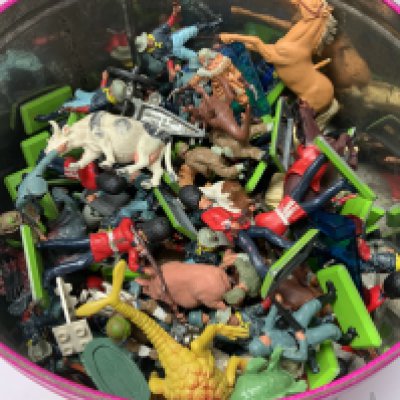 A tin of Britains toys.