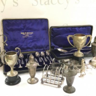 A Collection of silver plated ware including a cased set of spoons, salt and pepper shakers, napkin rings etc