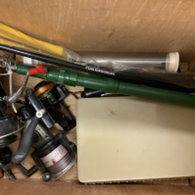 A fishing case an]d mixed fishing accessories.