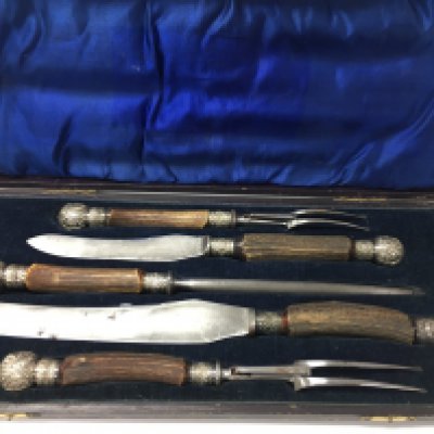 A stag horn cased carving set.Postage B