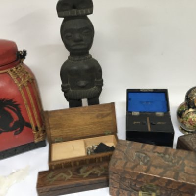 A carved hardwood tribal figure carved wood boxes a leather jewellery box and Russian doll and other items. NO RESERVE