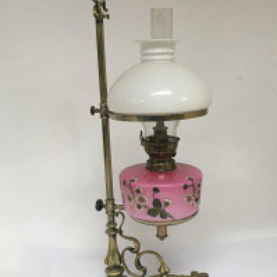 A Victorian brass telescopic oil lamp with a pink glass reservoir. NO RESERVE