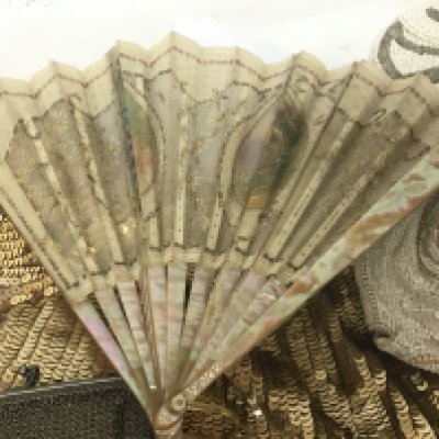 A French fan hand painted ovals on a fine fabric and mother of pearl supports vintage ladies bead work evening bags.