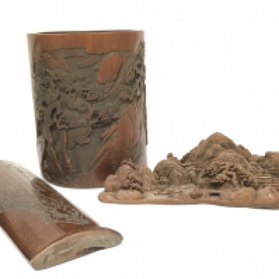 Chinese items including a bamboo brush pot with hand carved scene design, a bamboo wrist rest, a wooden carved landscape sculpture. Postage category B