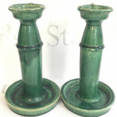 A pair of Chinese green glazed oil lamps, 24cm tall. This lot cannot be posted