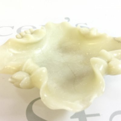 A Chinese white jade bowl, lotus form. 16.5cm wide. Restoration seen. This lot cannot be posted