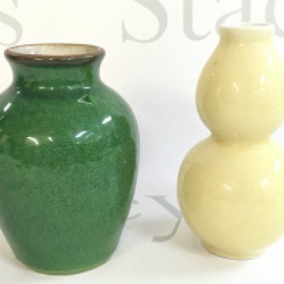 Two small Chinese vases, a yellow gourd shaped vase and a green crackle vase. 12 and 13cm tall. This lot cannot be posted