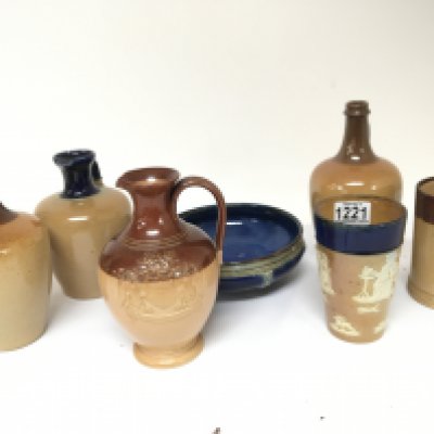 A collection of Royaland Lambeth Doulton stoneware ceramics bottle vases including a copy of the Salisbury jug a blue glazed dish and a beaker and others no obvious damage.
