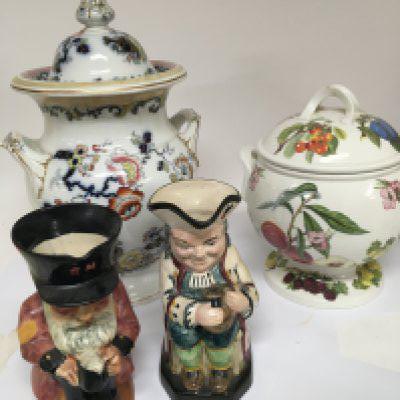 A Victorian Porcelain large size storage jar and cover, highttwo Caricature jugs and a large Portmeirion storage jar and cover. (4). NO RESERVE