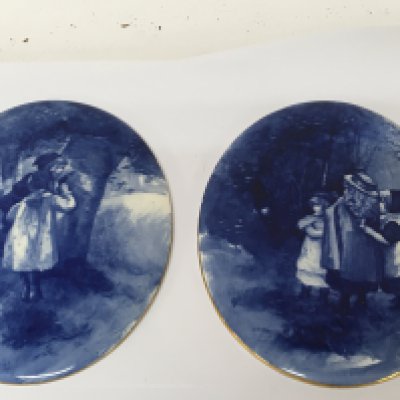 A pair of quality Doulton Burslem blue and white oval wall plaques decorated with figures of young children in a wooded landscape no obvious damage 24cm. NO RESERVE