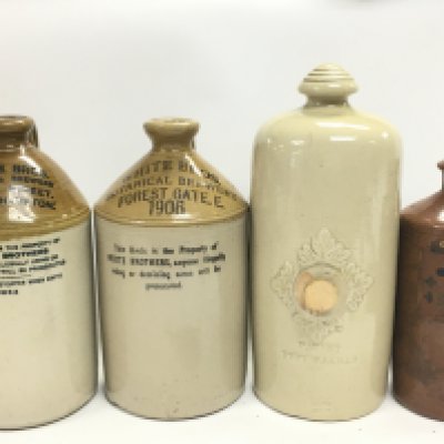 A Collection of stoneware bottles including 20th century Botanical brewers century White Bros bottles, Royal Doulton Lambeth Feet Warmer. This lot cannot be posted