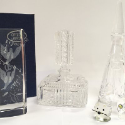 Cut glass scent bottles including Stuart , small figures and a 3D Crystal ornament. This lot cannot be posted