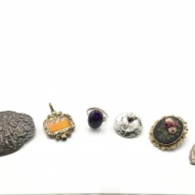 A silver brooch, a ring and other oddments