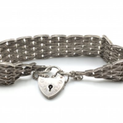 A silver hallmarked curb bracelet. Postage category A