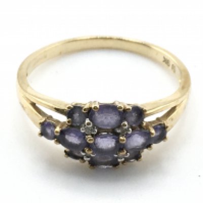 A 9 carat diamond and tanzanite ring, size T. 2.7g. Postage category a