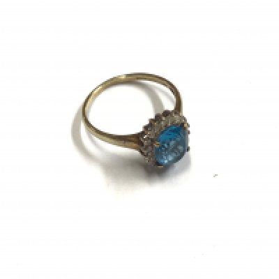 A 9ct gold topaz and diamond set ring. Approx weight 3.34 grams, approx size U.