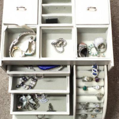 A jewellery box and contents including many silver pieces and other consisting of rings, bracelets, brooches etc. Postage category C
