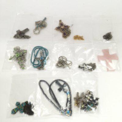 A collection of crosses some with chains. Postage category a