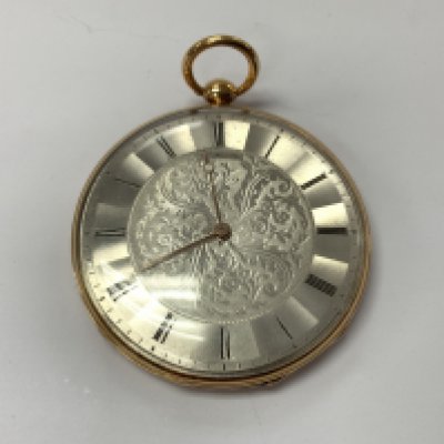 18ct gold outer case open pocket watch. Postage category A. Approximately 67.18g.