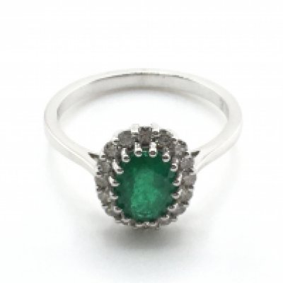 A certificated 18ct white gold emerald and diamond cluster ring, oval-cut diamond 1.18ct. RBC diamonds 0.32ct. Cert no. WGI9624148421. Size N. weight 3.2g. Postage category A