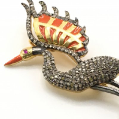 A silver gilt wading bird brooch inlaid with rich orange enamel and set with rose-cut diamonds, with a ruby eye. Diamonds 1.61ct, ruby 0.03ct