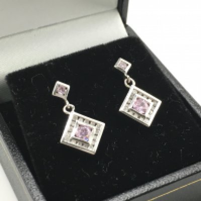 A 9ct white gold R/C pink gemstones and diamond articulated droplet earrings. Pink gemstones 0.24ct approx. R/C diamonds 0.18ct. Total weight 3g. Postage category a