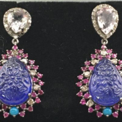 A pair of large drop earrings set with pear shaped carved tanzanites, turquoise, morganites, rubies and diamonds, stamped 14k with 9ct white gold backs. Tanzanites 27.19ct, morganites 3.63ct, diamonds 1.15ct, ruby 1.85ct. Total weight 13.4g Postage category a