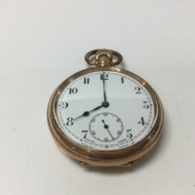 A gold plated pocket watch, seen working.