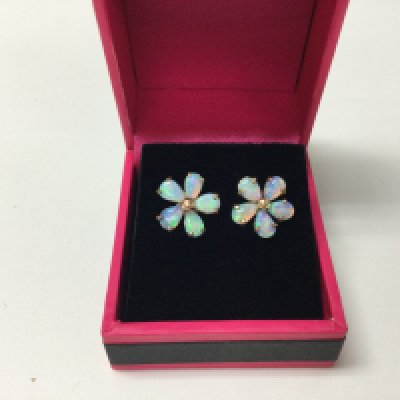A pair of 9ct gold opal set flower earrings.