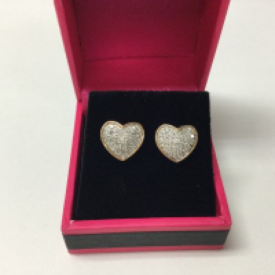 A pair of diamond set heart shaped earrings.