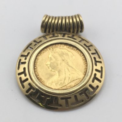 A 1896 half sovereign set in an 18ct gold pendant. 10.60g Postage A