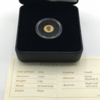 A 2019 maple leaf 0.5g gold proof coin. Postage B