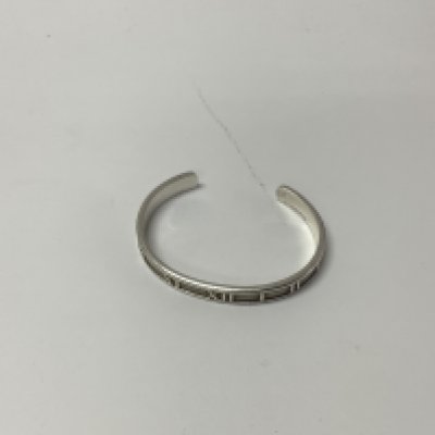 A silver tiffany & co atlas bangle.
