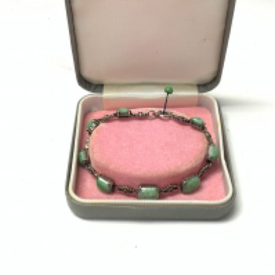 A ladies jade and silver bracelet.