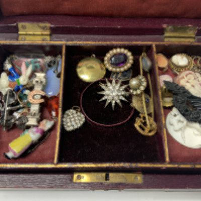 A Victorian box of costume jewellery.
