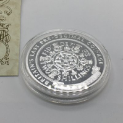 Silver proof anniversary florin coin with COA. Postage A
