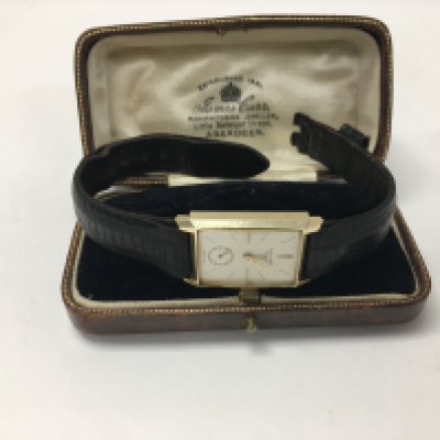 A vintage gents 14ct cased Longines watch.