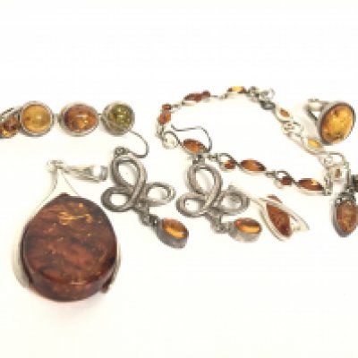 A Collection of silver and amber jewellery including earrings, bracelet etc. postage category A.