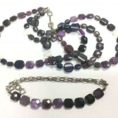 A Tateossian designer necklace and matching bracelet suspended on silver chains. Shipping category A.