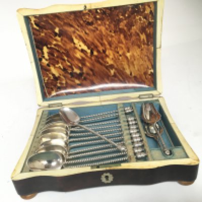 A set of Dutch silver spoons with acorn finials and twist stems in a 19th Century tortoiseshell case.