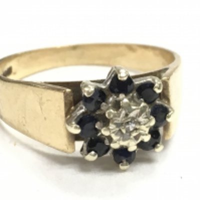 A 9 carat gold diamond & black sapphire ring, 3.7g, size Q, postage category A