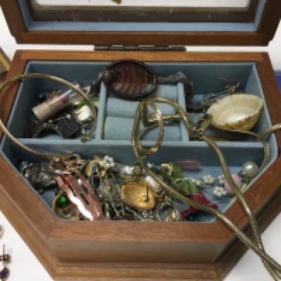 A collection of costume jewellery together with silver necklaces.