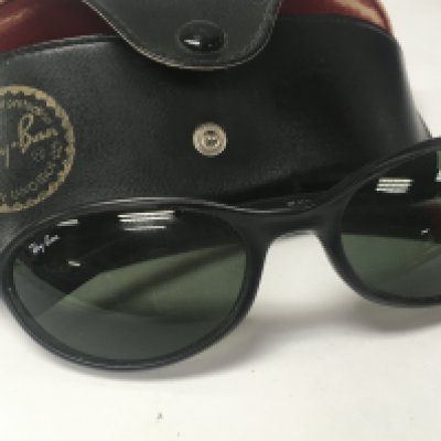 A pair of Ray Ban sun glasses in fitted case ..