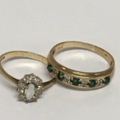 Two 9carat gold rings set with emerald diamonds the other ring with a central Opal (2)