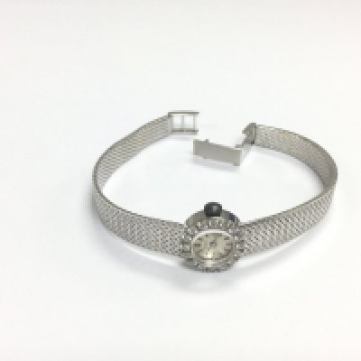 An 18ct white gold cased ladies watch with diamond set bezel, approx 27g. Shipping category A.